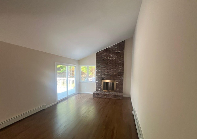 181 Wading River Hollow Rd, Ridge, NY 11961 - unfurnished living room featuring a baseboard radiator, wood finished floors, vaulted ceiling, and a fireplace