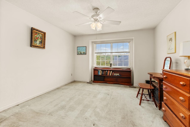 36 Spruce St Unit 36, Pawling, NY 12564 - bedroom with light colored carpet, a textured ceiling, a ceiling fan, and an office area