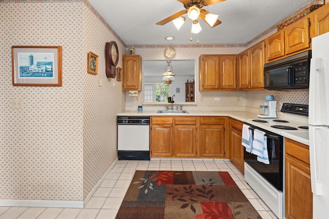 36 Spruce St Unit 36, Pawling, NY 12564 - kitchen featuring white appliances, light countertops, brown cabinetry, wallpapered walls, and a ceiling fan