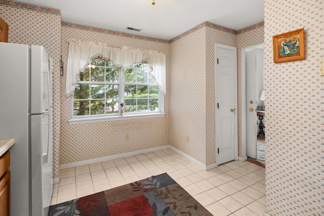 36 Spruce St Unit 36, Pawling, NY 12564 - unfurnished dining area with light tile patterned floors and wallpapered walls