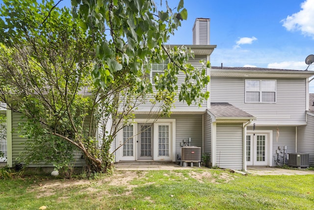 36 Spruce St Unit 36, Pawling, NY 12564 - back of property with french doors, a patio area, a yard, and a chimney