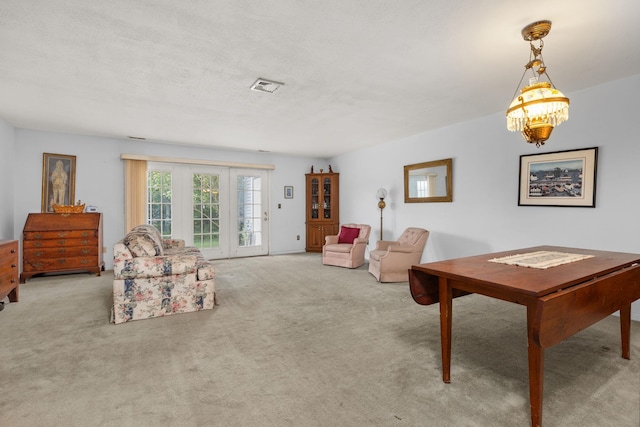 36 Spruce St Unit 36, Pawling, NY 12564 - living area featuring carpet floors and a chandelier