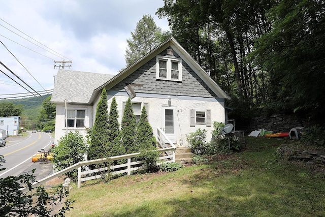 11620 State Route 97, Long Eddy, NY 12760 - view of front of property featuring a shingled roof and stucco siding