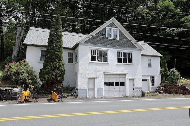 11620 State Route 97, Long Eddy, NY 12760 - view of front of home with stucco siding, a shingled roof, and an attached garage