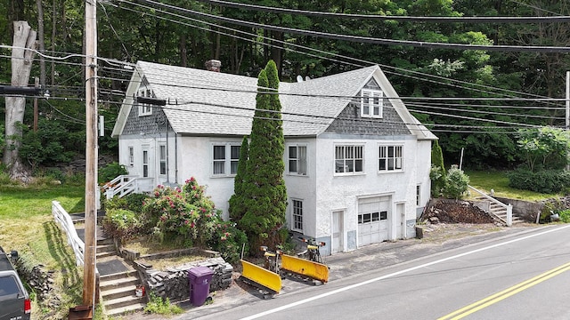 11620 State Route 97, Long Eddy, NY 12760 - view of front of property featuring roof with shingles, stucco siding, and an attached garage
