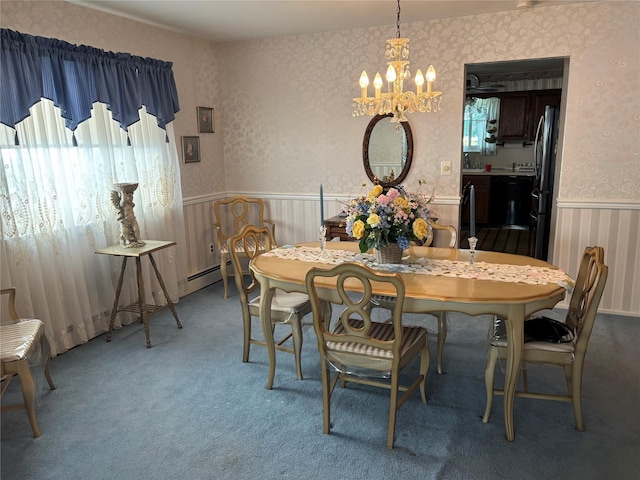 557 Southside Ave, Freeport, NY 11520 - dining area with a chandelier, carpet floors, wainscoting, and wallpapered walls
