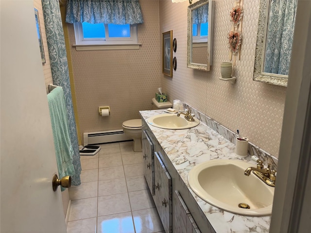 557 Southside Ave, Freeport, NY 11520 - full bath featuring a baseboard radiator, double vanity, tile patterned flooring, and a shower with curtain