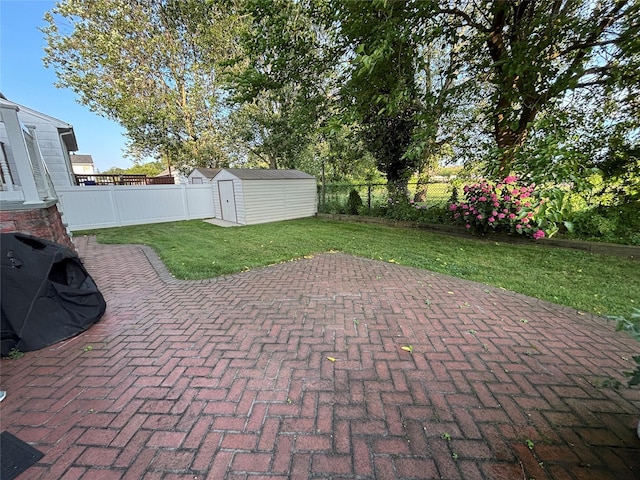 557 Southside Ave, Freeport, NY 11520 - fenced backyard with a patio area and a storage shed
