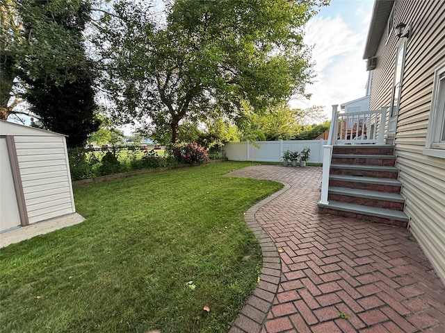 557 Southside Ave, Freeport, NY 11520 - fenced backyard with a patio area and a storage shed