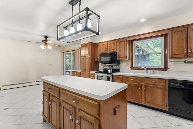15 Glen Dr, South Salem, NY 10590 - kitchen with black appliances, a baseboard radiator, a center island, brown cabinetry, and light countertops