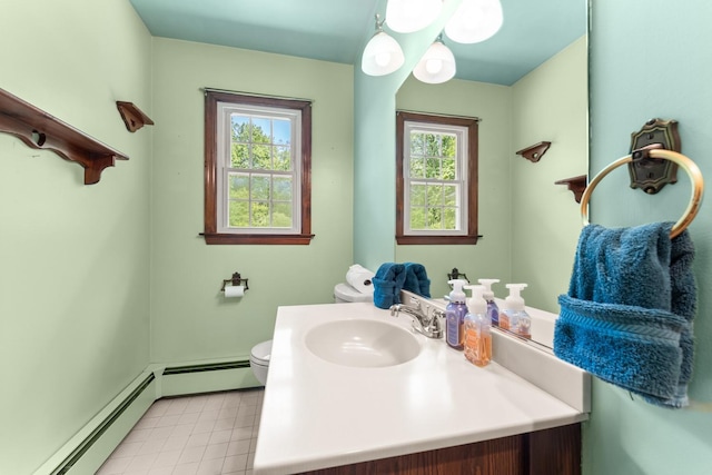 15 Glen Dr, South Salem, NY 10590 - half bathroom with baseboard heating, vanity, and tile patterned floors