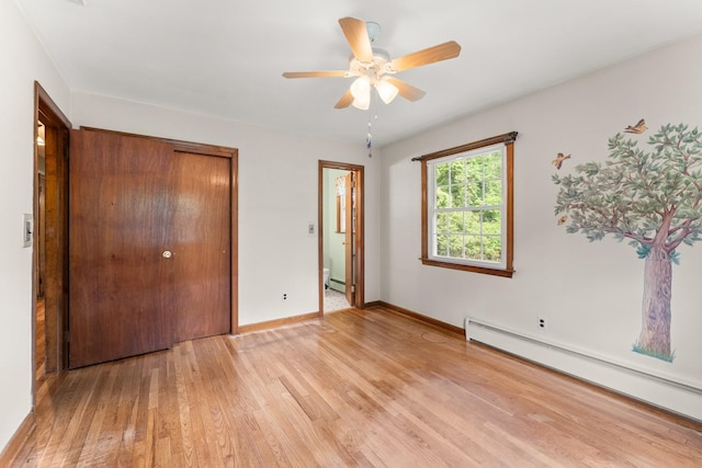 15 Glen Dr, South Salem, NY 10590 - unfurnished bedroom featuring a baseboard heating unit, light wood-type flooring, a closet, and ensuite bath