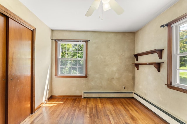 15 Glen Dr, South Salem, NY 10590 - unfurnished bedroom featuring a baseboard radiator, wood finished floors, and multiple windows