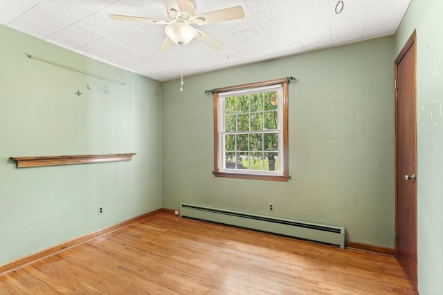15 Glen Dr, South Salem, NY 10590 - empty room featuring baseboard heating, wood finished floors, and a ceiling fan