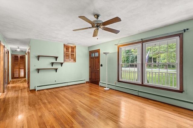 15 Glen Dr, South Salem, NY 10590 - unfurnished living room with a baseboard radiator, wood finished floors, and a ceiling fan