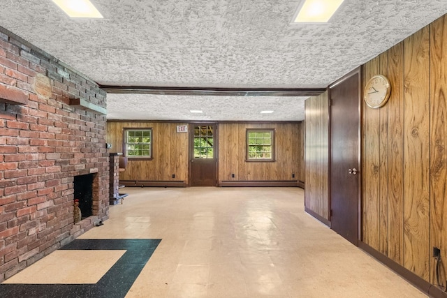 15 Glen Dr, South Salem, NY 10590 - corridor featuring tile patterned floors, wood walls, a baseboard radiator, and a textured ceiling