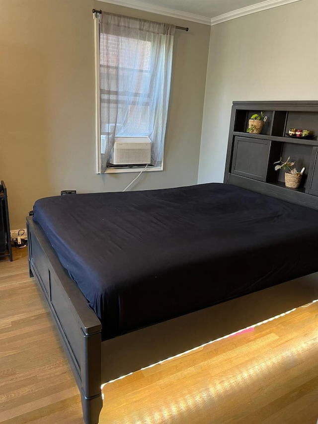 150-10 71st Ave Unit 2G, Kew Garden Hills, NY 11367 - bedroom with cooling unit, ornamental molding, and light wood-style floors