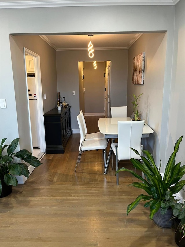 150-10 71st Ave Unit 2G, Kew Garden Hills, NY 11367 - dining room featuring wood finished floors and crown molding