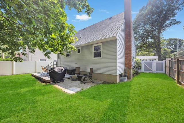 15 Halewood Dr, Shirley, NY 11967 - back of house with roof with shingles, a fenced backyard, a gate, and a patio
