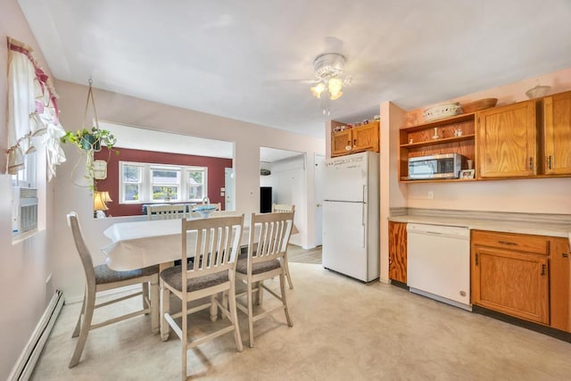 15 Halewood Dr, Shirley, NY 11967 - dining room with a baseboard heating unit and ceiling fan