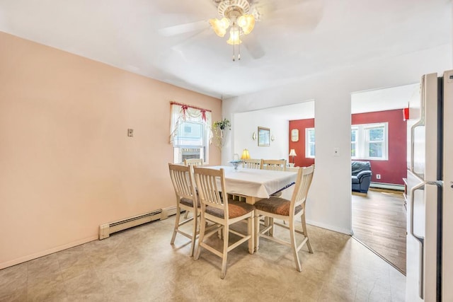 15 Halewood Dr, Shirley, NY 11967 - dining space with baseboard heating, a baseboard heating unit, and a ceiling fan