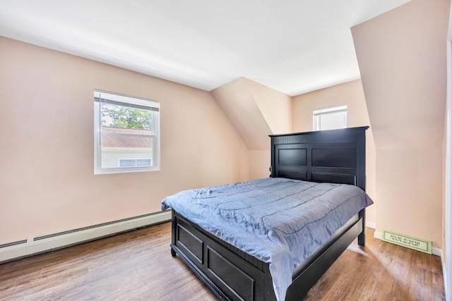 15 Halewood Dr, Shirley, NY 11967 - bedroom with a baseboard radiator and light wood-style floors