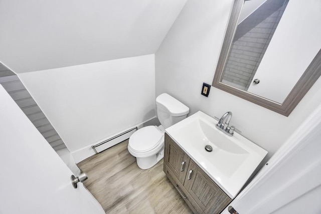 15 Halewood Dr, Shirley, NY 11967 - bathroom with baseboard heating, vanity, and wood finished floors