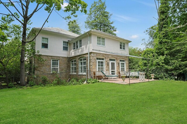50 Forest Cir, New Rochelle, NY 10804 - rear view of house featuring stone siding, a patio area, and a yard