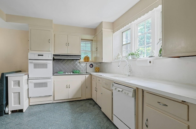50 Forest Cir, New Rochelle, NY 10804 - kitchen with white appliances, decorative backsplash, light countertops, and under cabinet range hood