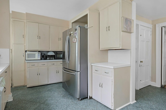 50 Forest Cir, New Rochelle, NY 10804 - kitchen with freestanding refrigerator, white microwave, light countertops, and light floors