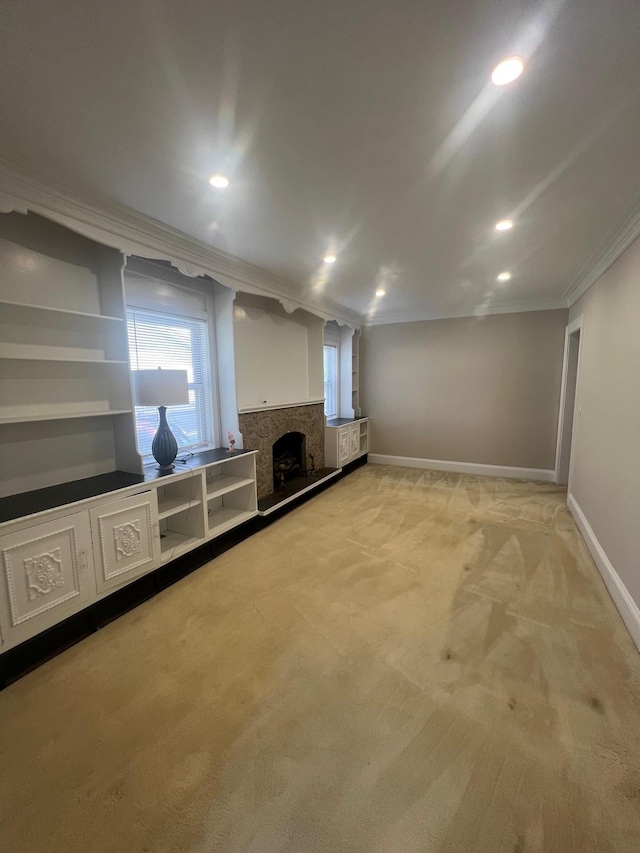 234 S 7th St, Lindenhurst, NY 11757 - basement featuring ornamental molding, light colored carpet, recessed lighting, and a fireplace with raised hearth