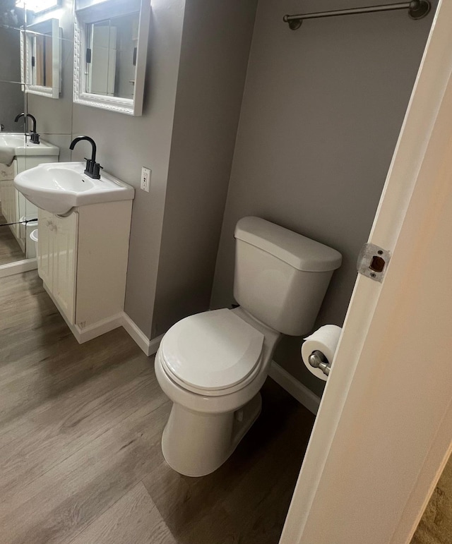 234 S 7th St, Lindenhurst, NY 11757 - bathroom featuring wood finished floors and vanity