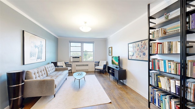 90-02 63rd Dr Unit 5J, Rego Park, NY 11374 - living room featuring radiator heating unit, crown molding, and wood finished floors