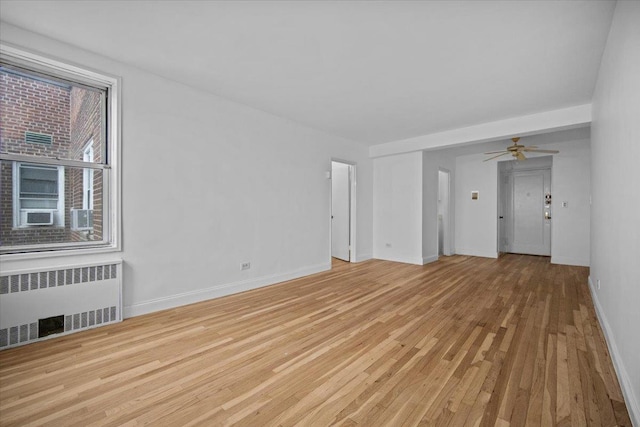 2102 Holland Ave Unit 6D, Bronx, NY 10462 - spare room featuring radiator, light wood finished floors, and ceiling fan