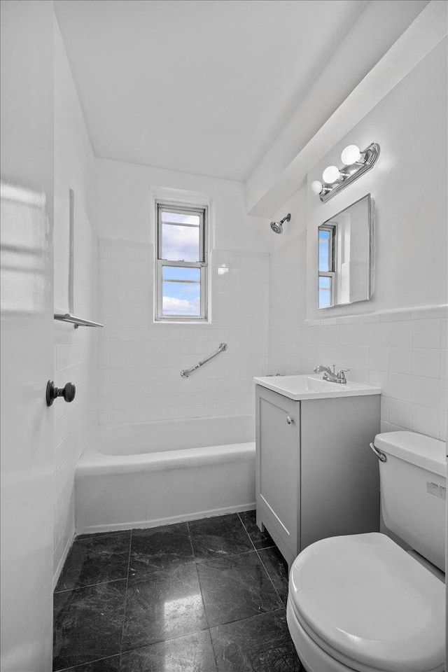 2102 Holland Ave Unit 6D, Bronx, NY 10462 - full bathroom featuring vanity, tub / shower combination, a wainscoted wall, and tile walls