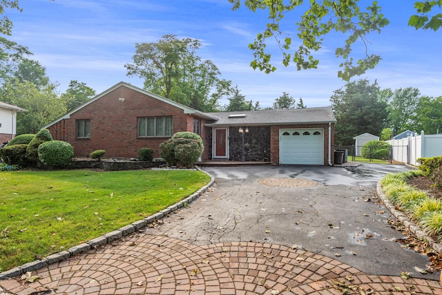 60 Wheatfield Ln, Commack, NY 11725 - view of front of property featuring brick siding, an attached garage, driveway, and a gate