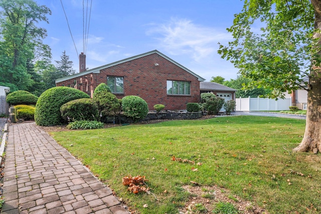 60 Wheatfield Ln, Commack, NY 11725 - view of front of house featuring brick siding, a chimney, asphalt driveway, and a garage