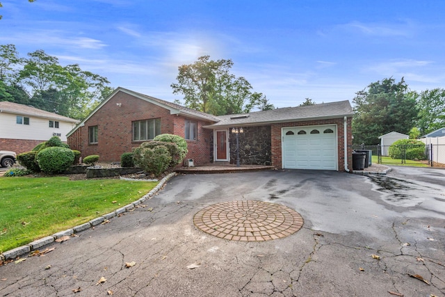 60 Wheatfield Ln, Commack, NY 11725 - view of front of house featuring curved driveway, brick siding, a garage, and a gate
