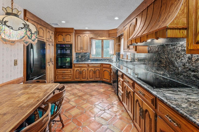 60 Wheatfield Ln, Commack, NY 11725 - kitchen featuring black appliances, brown cabinetry, custom range hood, a textured ceiling, and wallpapered walls
