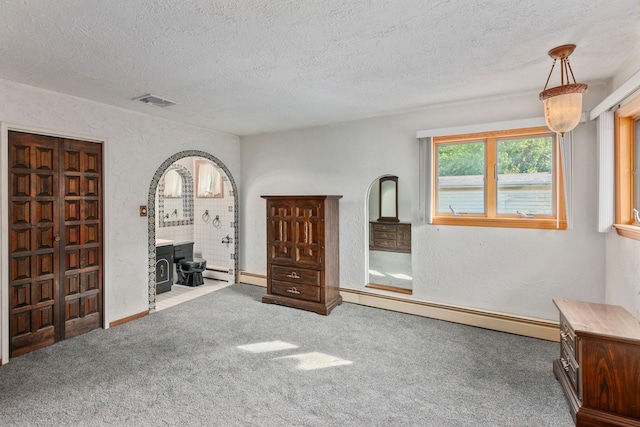 60 Wheatfield Ln, Commack, NY 11725 - carpeted bedroom featuring a baseboard heating unit and a textured ceiling