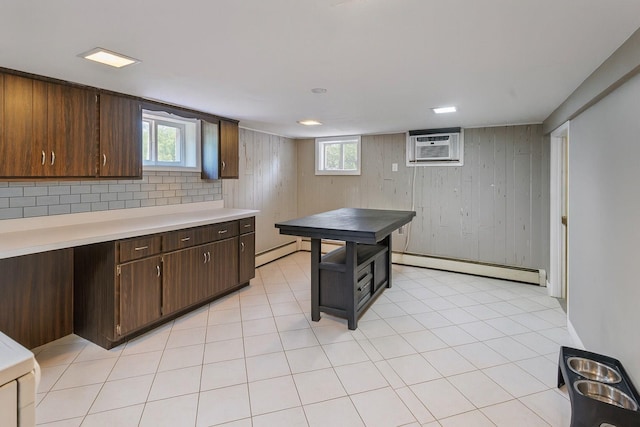 60 Wheatfield Ln, Commack, NY 11725 - kitchen with a baseboard heating unit, an AC wall unit, light countertops, and healthy amount of natural light