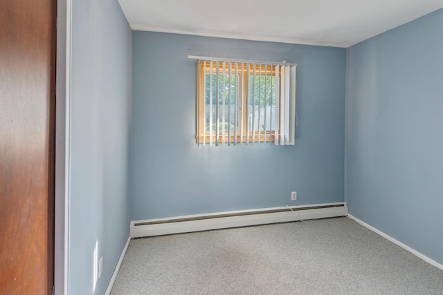 60 Wheatfield Ln, Commack, NY 11725 - unfurnished room with a baseboard heating unit and carpet flooring