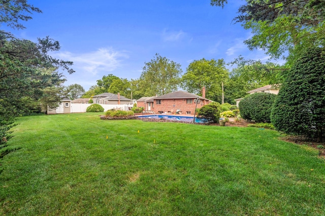 60 Wheatfield Ln, Commack, NY 11725 - view of grassy yard with an outdoor pool