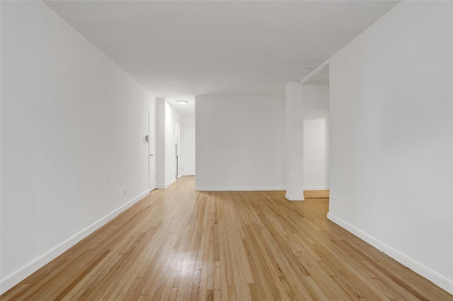 123-25 82nd Ave Unit 5R, Kew Gardens, NY 11415 - spare room featuring light wood-style flooring and baseboards