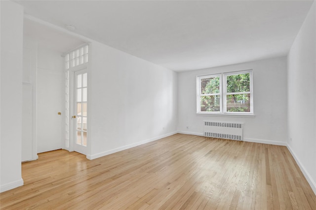 123-25 82nd Ave Unit 5R, Kew Gardens, NY 11415 - unfurnished room featuring radiator and wood-type flooring