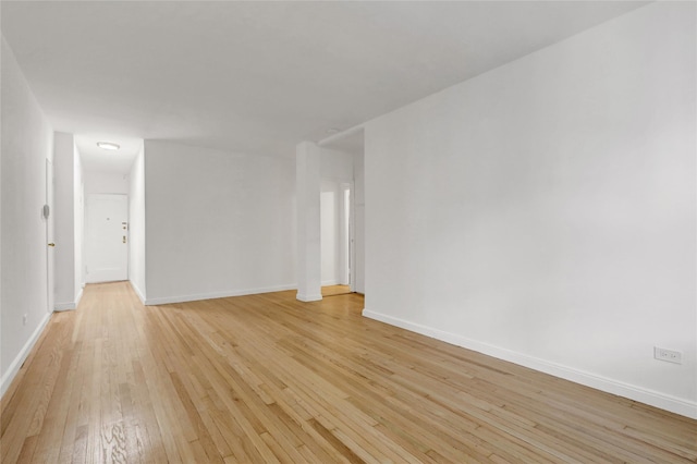 123-25 82nd Ave Unit 5R, Kew Gardens, NY 11415 - spare room featuring light wood-style flooring and baseboards