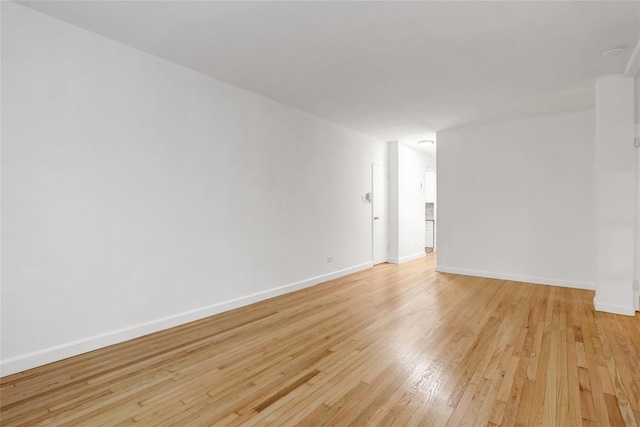 123-25 82nd Ave Unit 5R, Kew Gardens, NY 11415 - spare room featuring light wood-style floors and baseboards