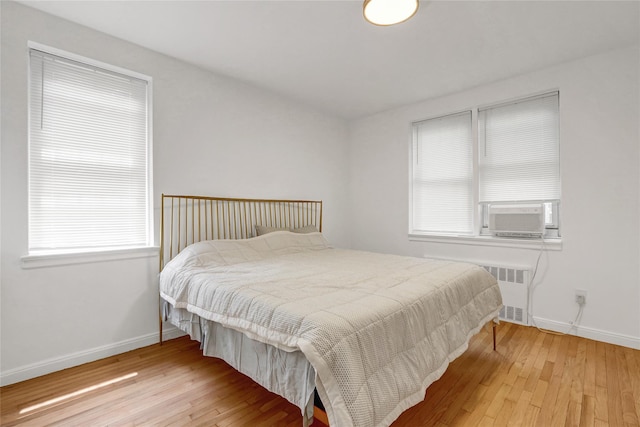 123-25 82nd Ave Unit 5R, Kew Gardens, NY 11415 - bedroom featuring hardwood / wood-style floors and radiator heating unit