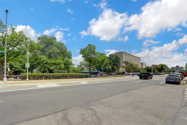 123-25 82nd Ave Unit 5R, Kew Gardens, NY 11415 - view of asphalt street with street lighting, traffic signs, traffic lights, and curbs