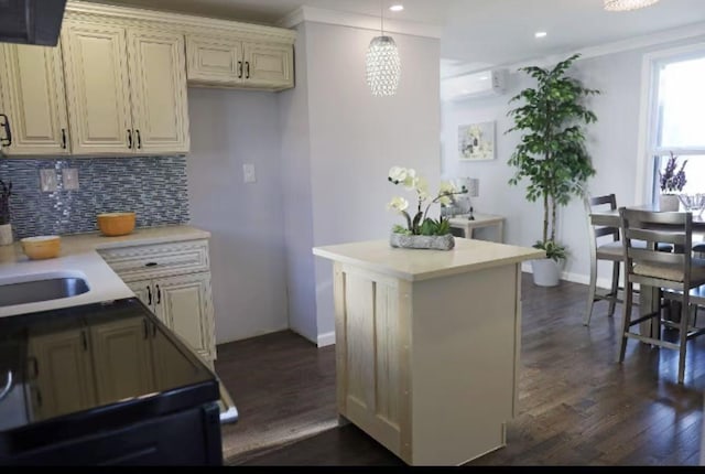 7-12 125th St, College Point, NY 11356 - kitchen featuring a wall mounted air conditioner, dark wood-style floors, tasteful backsplash, light countertops, and crown molding